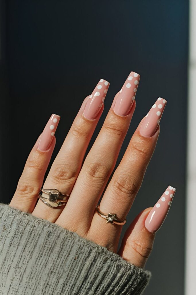 Playful pink coffin nails with white polka dot tips