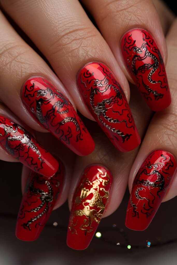 Red nails with detailed dragon patterns in black or gold, appearing fierce and mythical