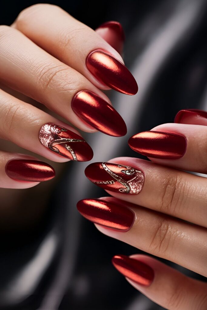 Red nails with luxurious copper accents, such as glitter or foils