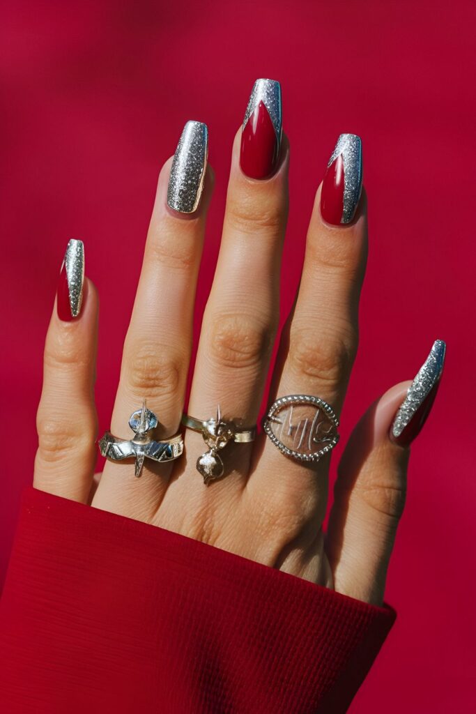 Red nails with sleek silver accents in the form of glitter, foils, or nail tape, suitable for day and night events