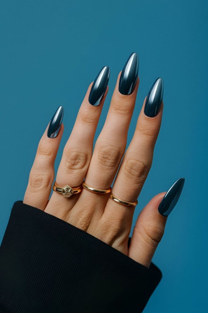 Reflective, metallic blue chrome nails with a sleek finish