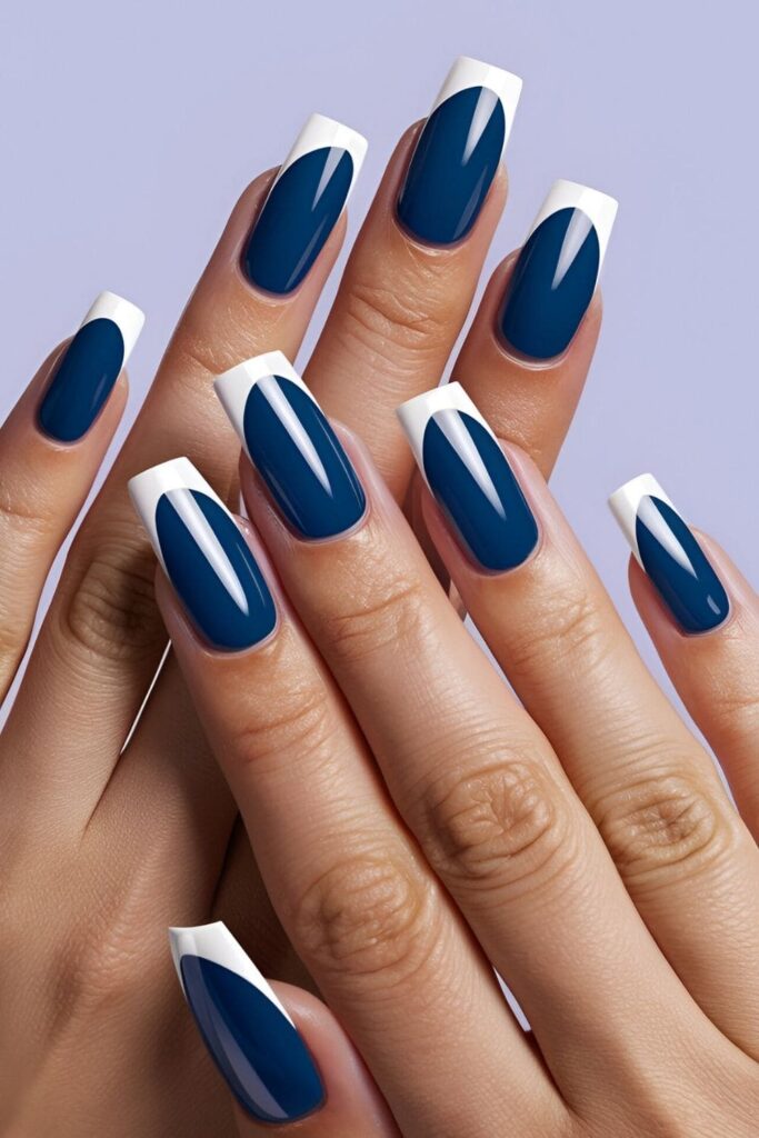 Royal blue nails with white tips, creating a modern take on the classic French manicure with a deep blue base and crisp white tips