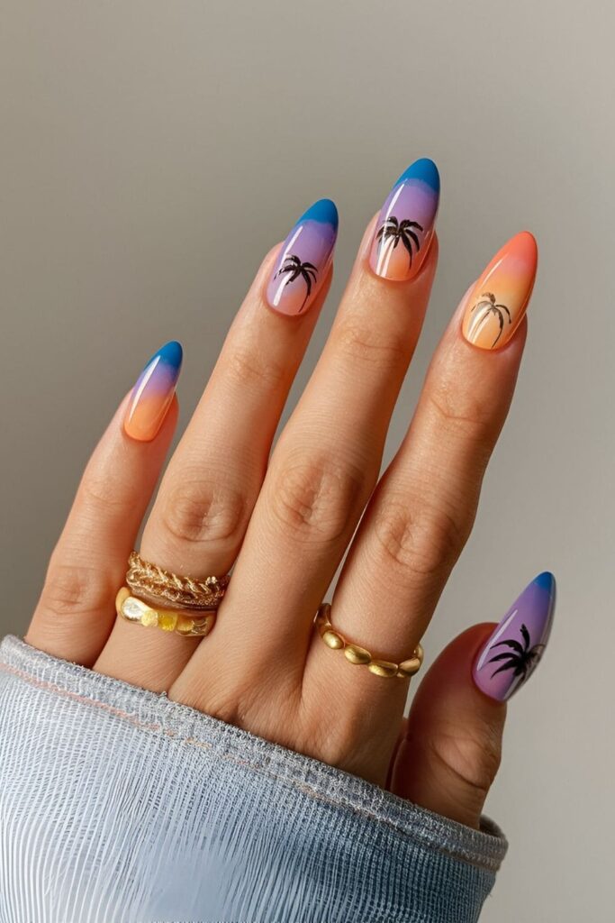 Short acrylic nails with tropical sunset theme, gradient colors from orange to pink to purple, scenic and vibrant