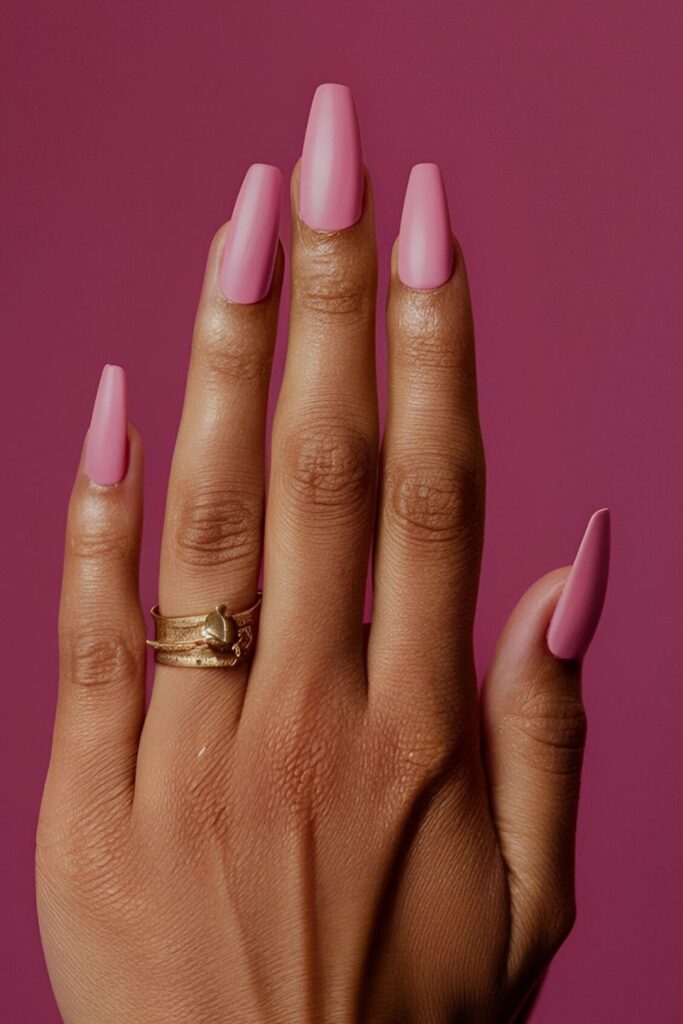 Soft matte pink acrylic nails, providing a modern and sophisticated look