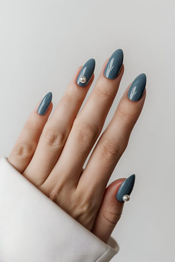 Sophisticated blue acrylic nails with tiny pearl accents