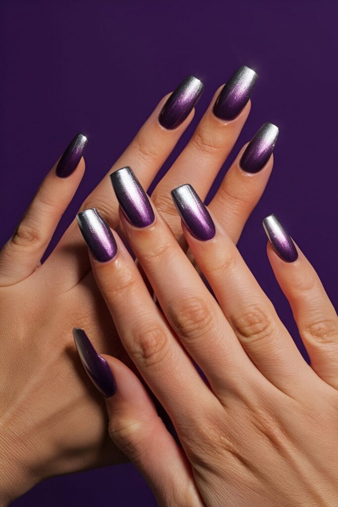 Striking ombre nails starting with purple at the base and fading into silver tips for a bold, sophisticated look