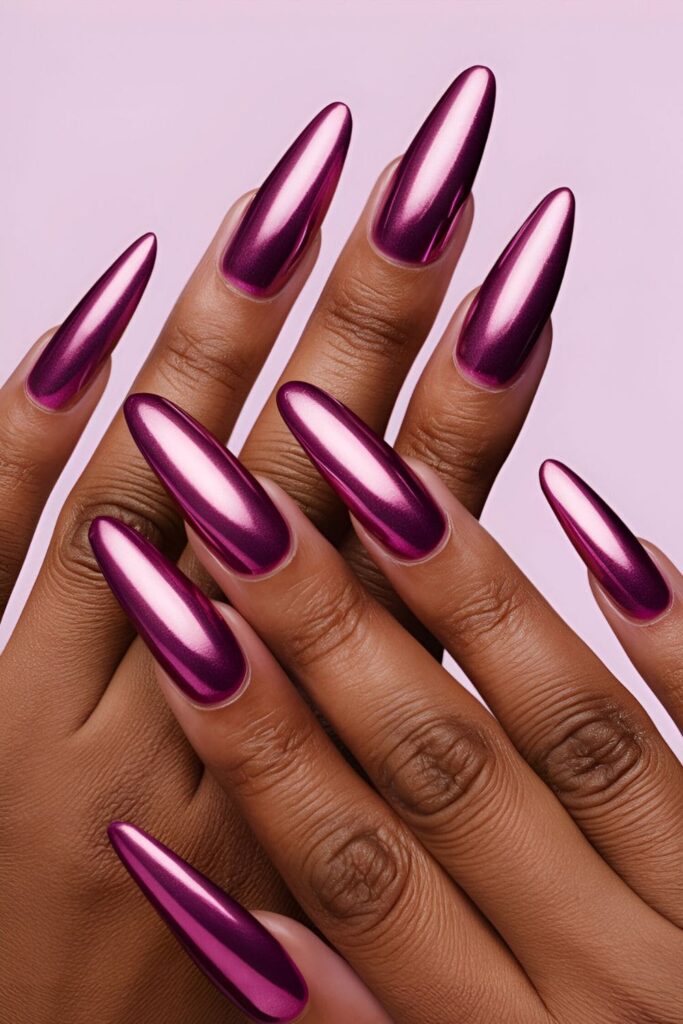 Striking pink chrome acrylic nails with a mirror-like finish, tailored to look stunning on dark skin tones