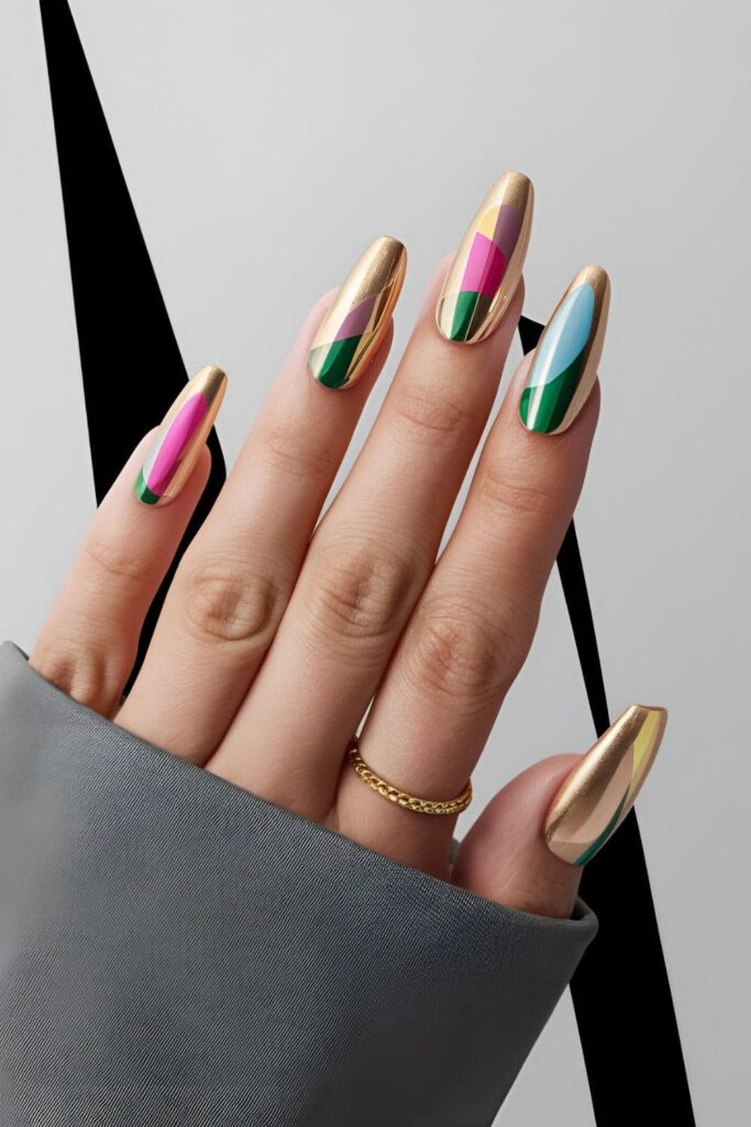 Stylish gold acrylic nails with color block designs in various shades, offering a modern and trendy look