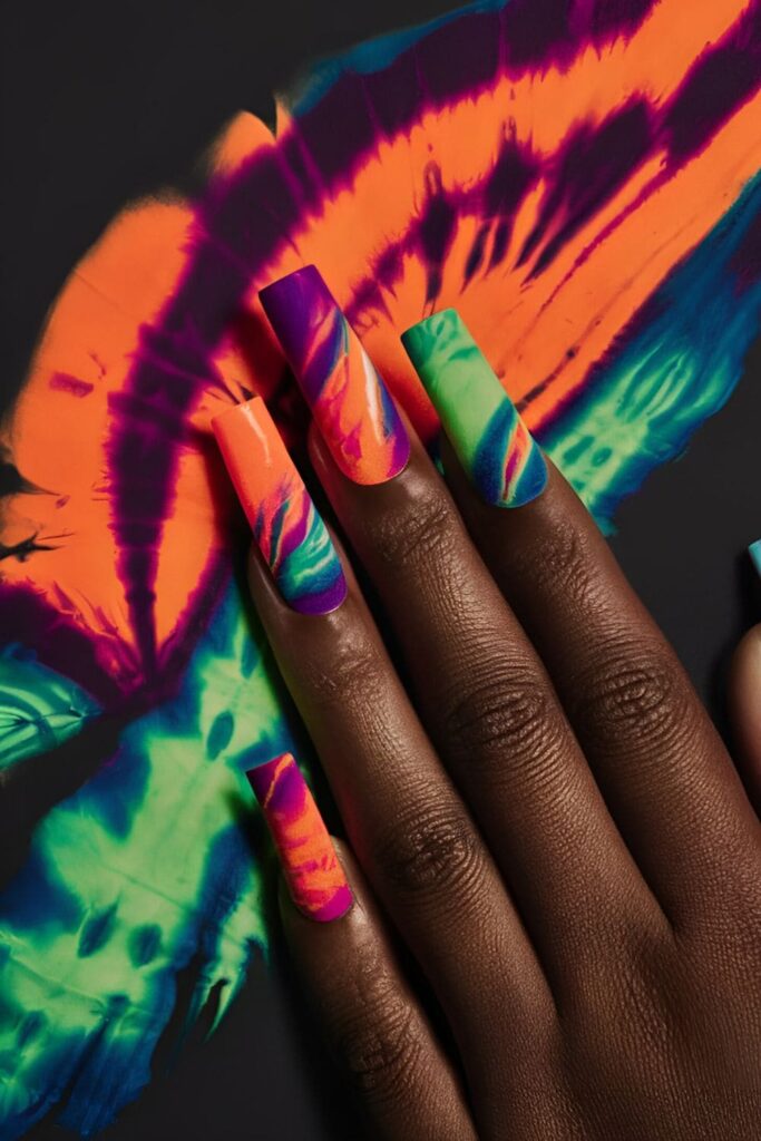 Tie-dye nail art with bright swirling colors