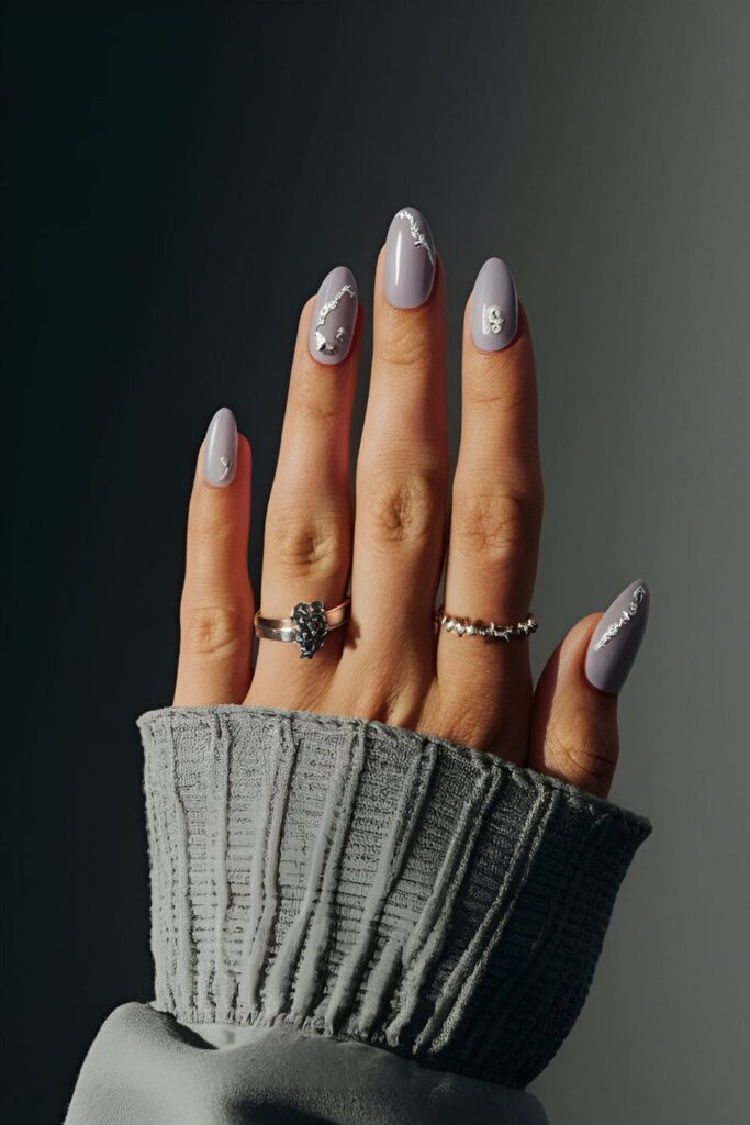 Translucent gray or lavender nails with white and silver accents, creating a moonlit mist effect with added shimmer