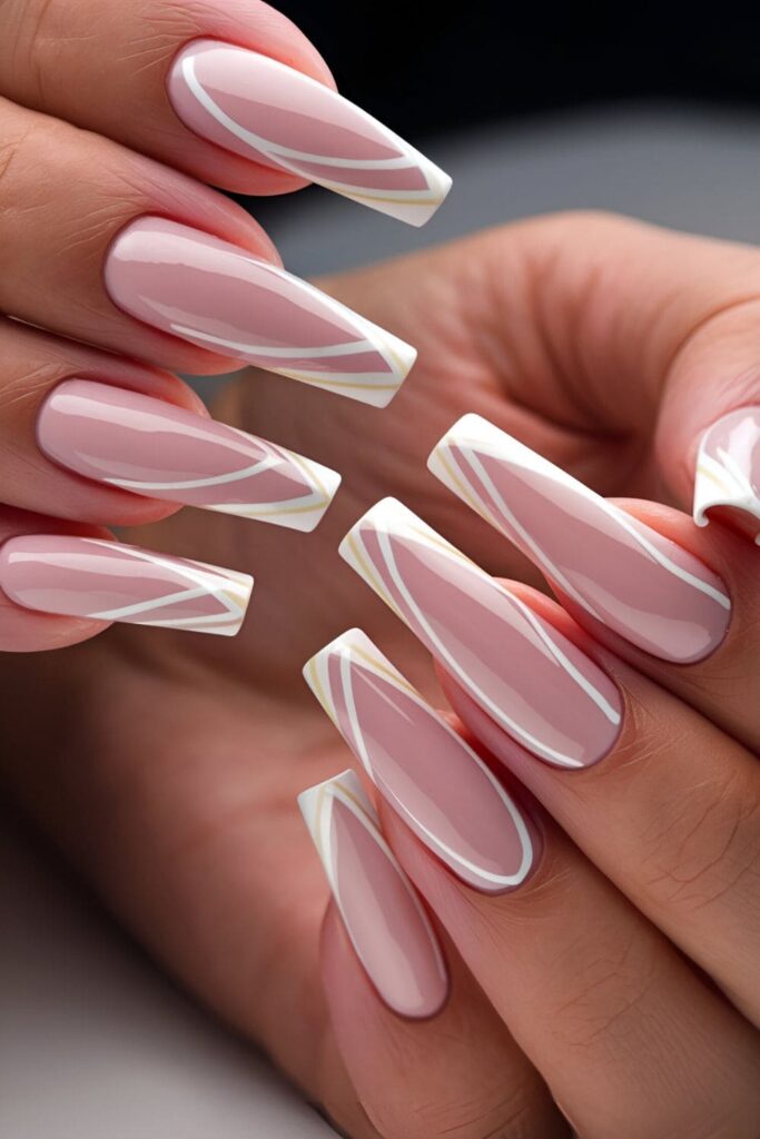 Trendy pink coffin nails with chevron patterns at the tips in white