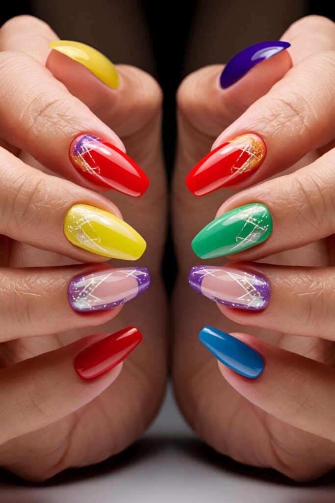 close-up of bright and cheerful acrylic nails with each nail showcasing a different vibrant color of the rainbow