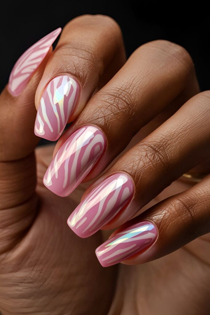 Bold pink zebra print acrylic nails, tailored for dark skin tones with striking pink stripes

