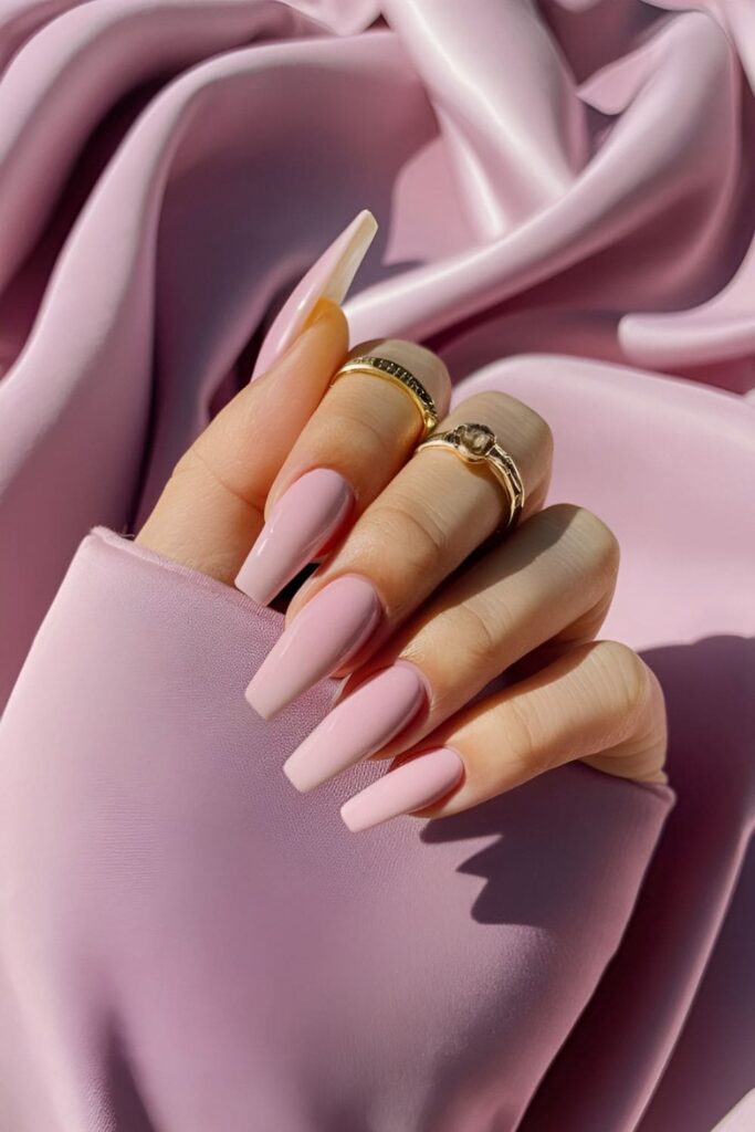 Acrylic nails with a soft, plush velvet finish in a classic, sophisticated color