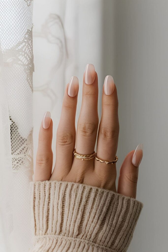 Acrylic nails with sheer pink or nude polish for a delicate, translucent effect