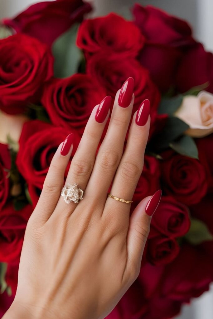 Classic bold red acrylic nails matching a dramatic bridal lipstick