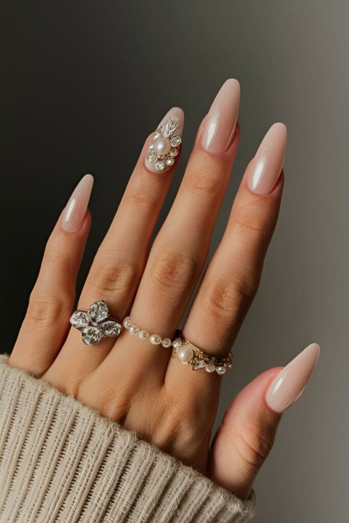 Luxurious acrylic nails combining pearls and rhinestones for an elegant look, ideal for weddings or formal events