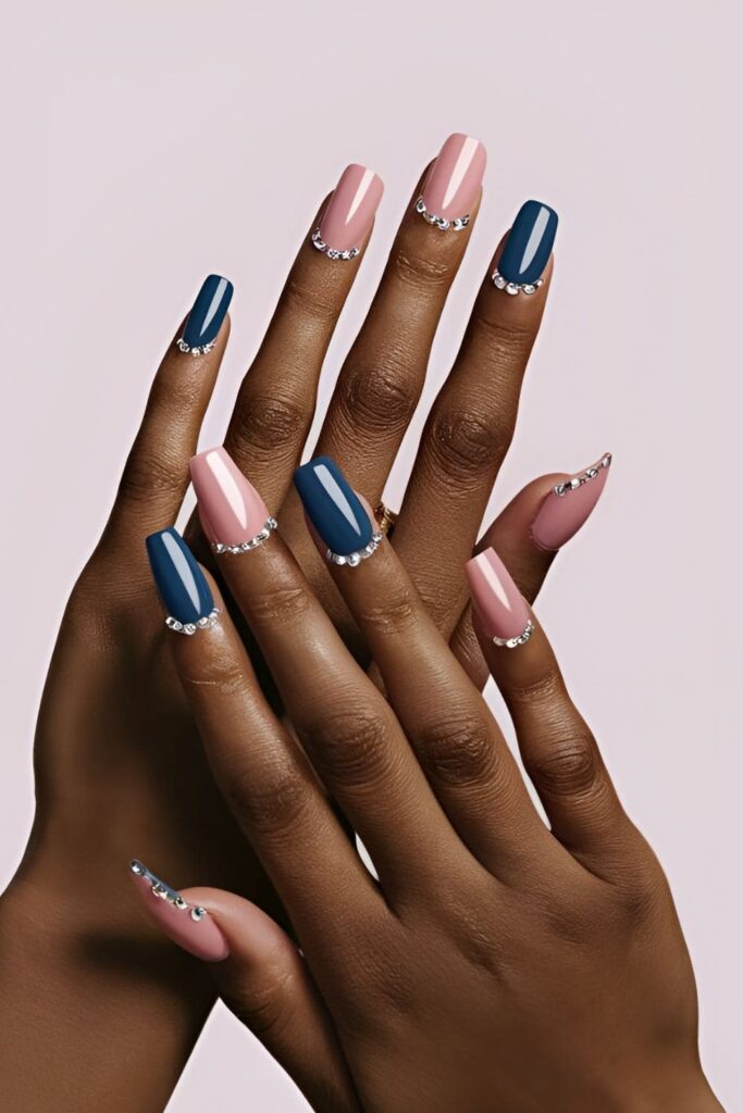 Modern two-tone acrylic nails with contrasting colors and rhinestones along the dividing line for a seamless, polished finish