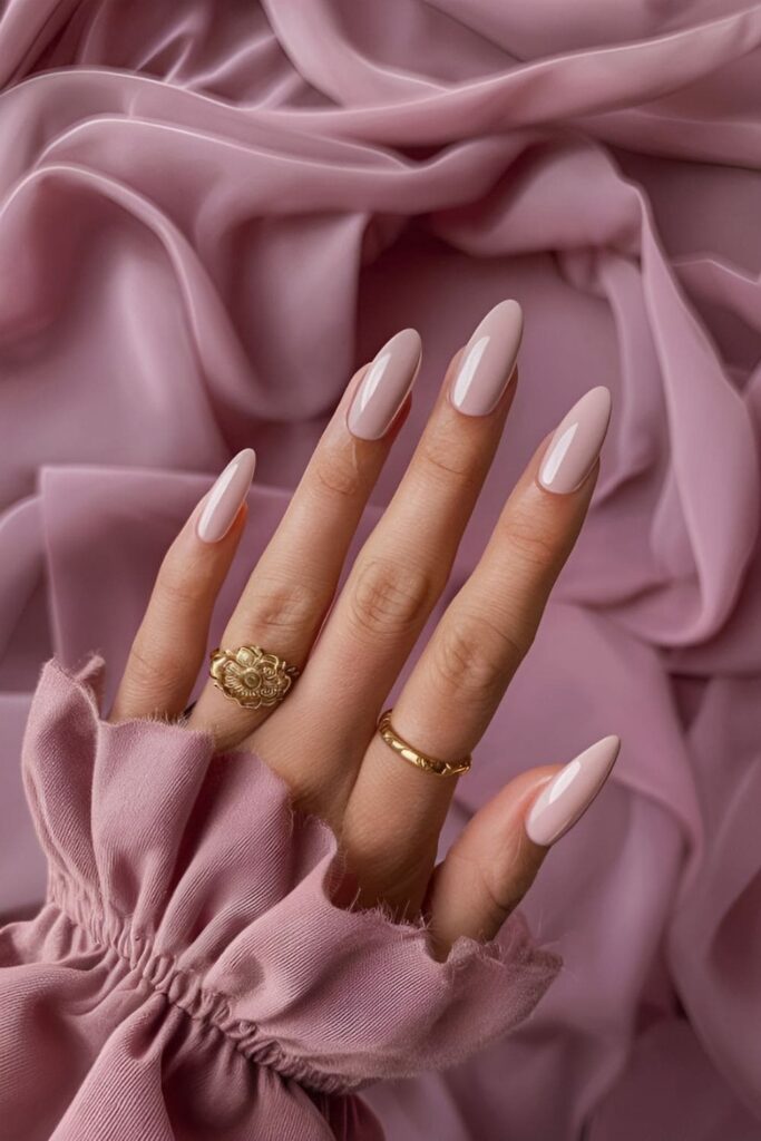 Monochromatic soft pink acrylic nails in various shades for a simple, elegant look