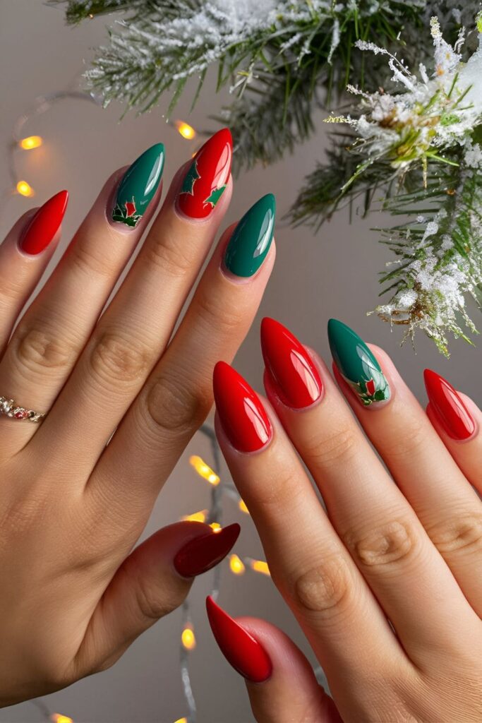 Acrylic nails with alternating red and green colors, some featuring small holly leaf accents