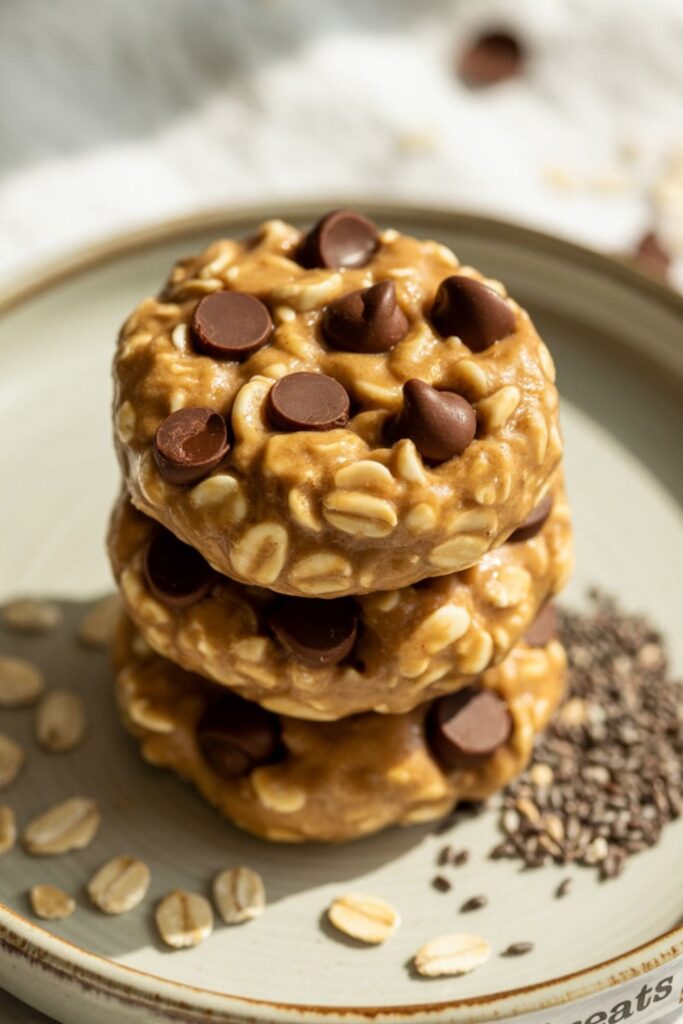 Healthy peanut butter energy bites rolled in oats and chocolate chips on a rustic plate